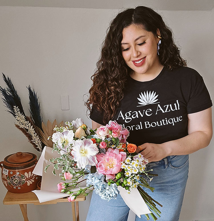 Paola Gonzalez at Agave Azul Floral Boutique holding a hand-tied bouquet