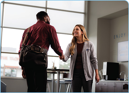 Fox team member shaking hands with member at Fox Communities Credit Union