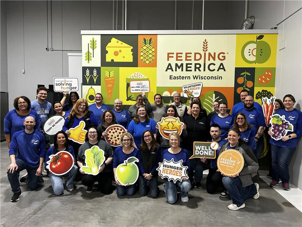 Fox team members volunteering at Feeding America